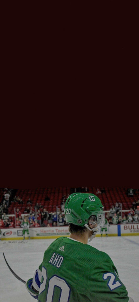 Sebastian Aho in Green Jersey: Game-Ready Ice Hockey Wallpaper