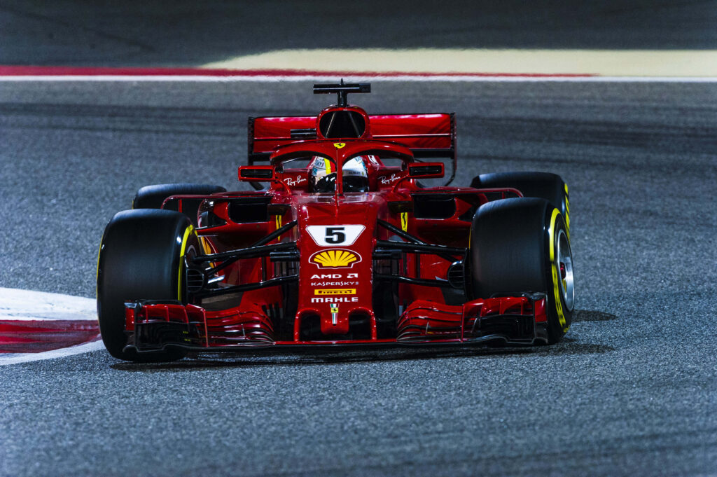 Sebastian Vettel Speeding with the Ferrari SF71H: A Captivating F1 2018 Wallpaper