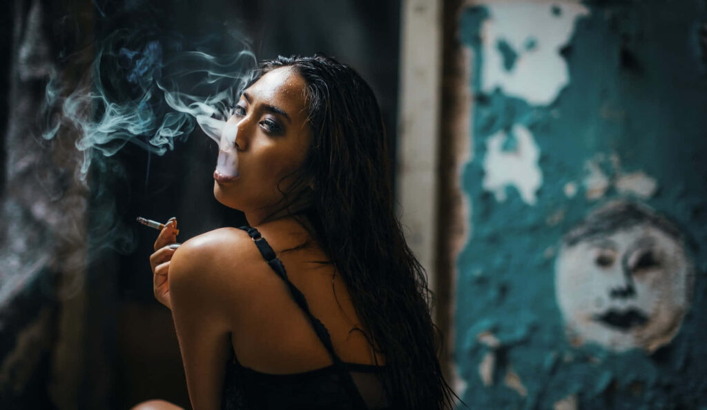 Seductive Asian Temptress: Enigmatic Beauty in a Smoky Background Wallpaper