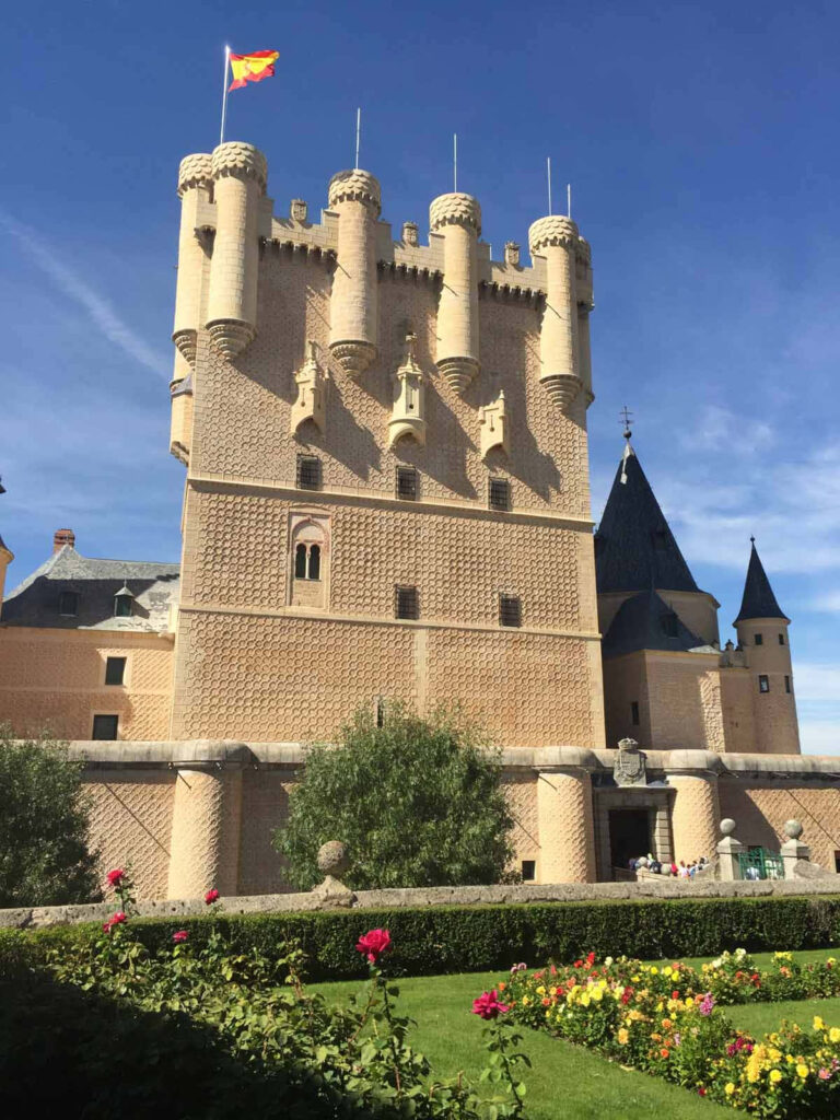 Stunning Segovia Castle Wallpaper: Historic Architecture & Colorful Garden
