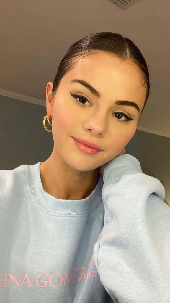 Elegant Selena Gomez Wallpaper: Soft Sweatshirt & Chic Charm