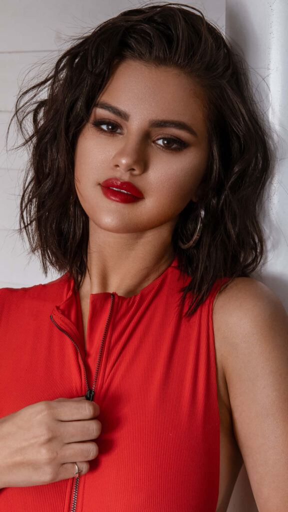 Selena Gomez in Red: Captivating iPhone Wallpaper Background