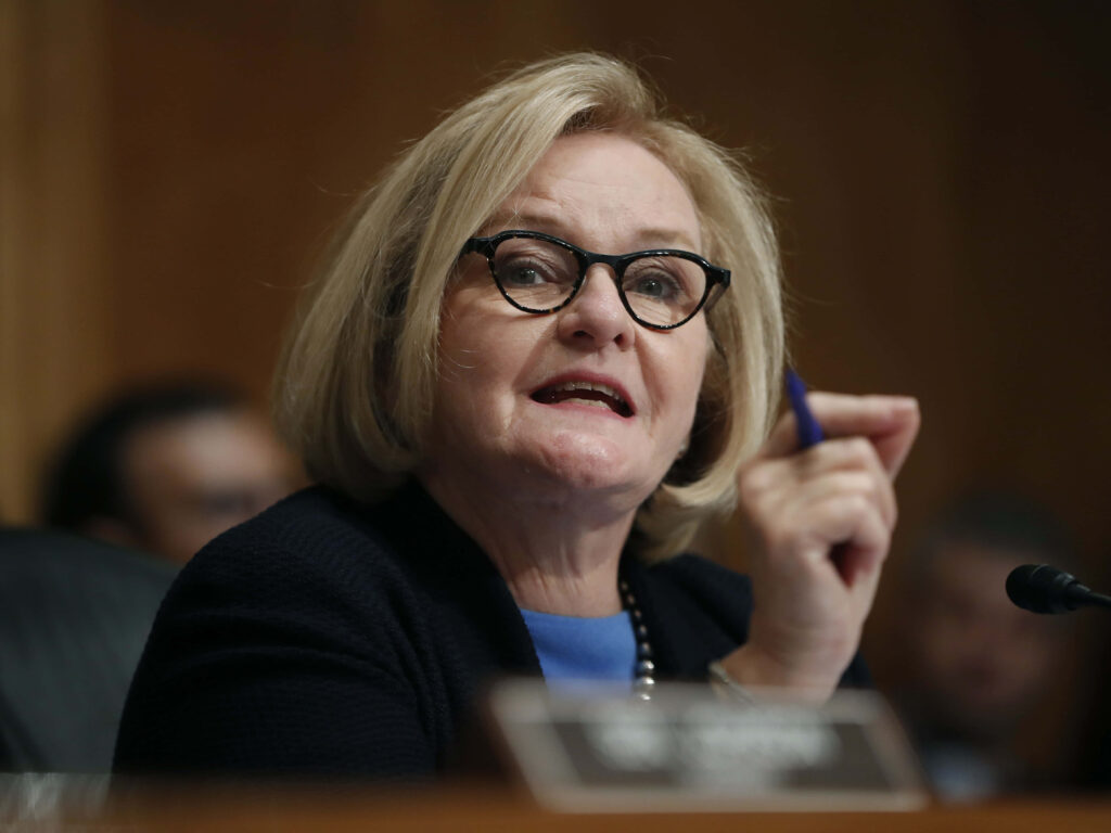 Senator Claire McCaskill speaking passionately during Senate hearing in formal setting with warm tones Wallpaper