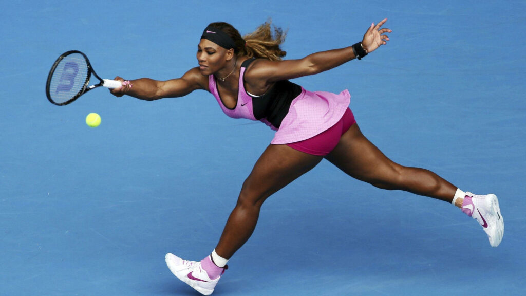 Serena Williams reaching for tennis ball on court showcasing athleticism and determination wallpaper