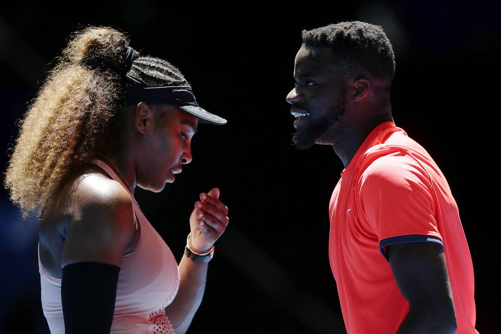 Serena Williams and Frances Tiafoe intense tennis match spotlighted cinematic sports wallpaper