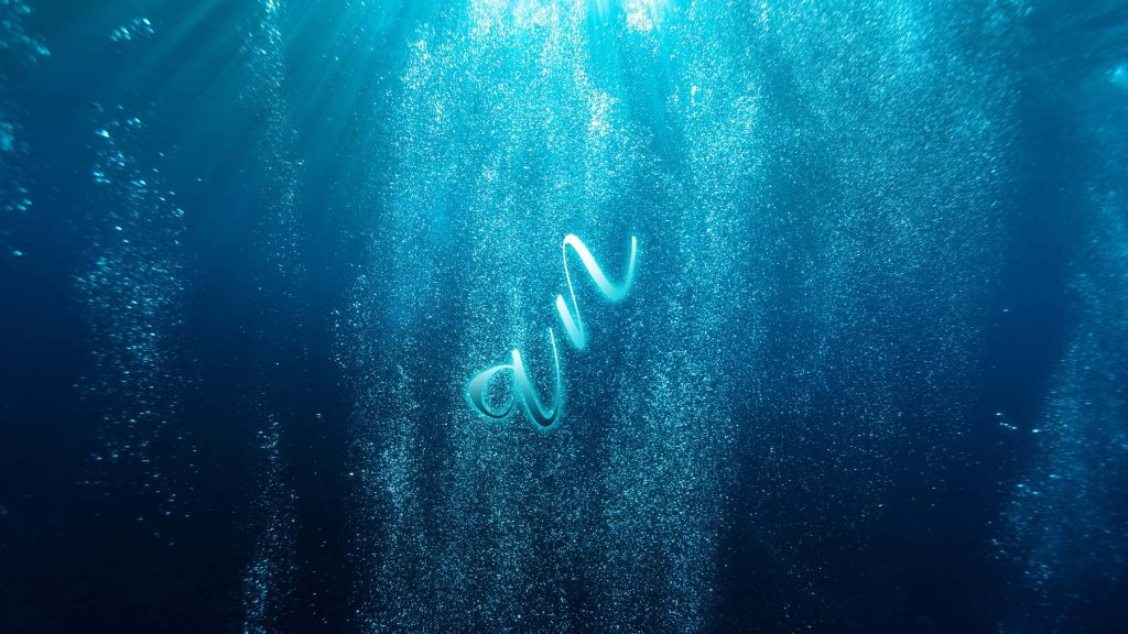 4K ocean wallpaper with stylized text an floating in deep blue water with rising air bubbles