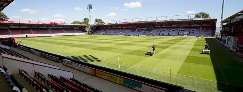 Panoramic AFC Bournemouth Stadium: Lush Field, Blue Sky Wallpaper