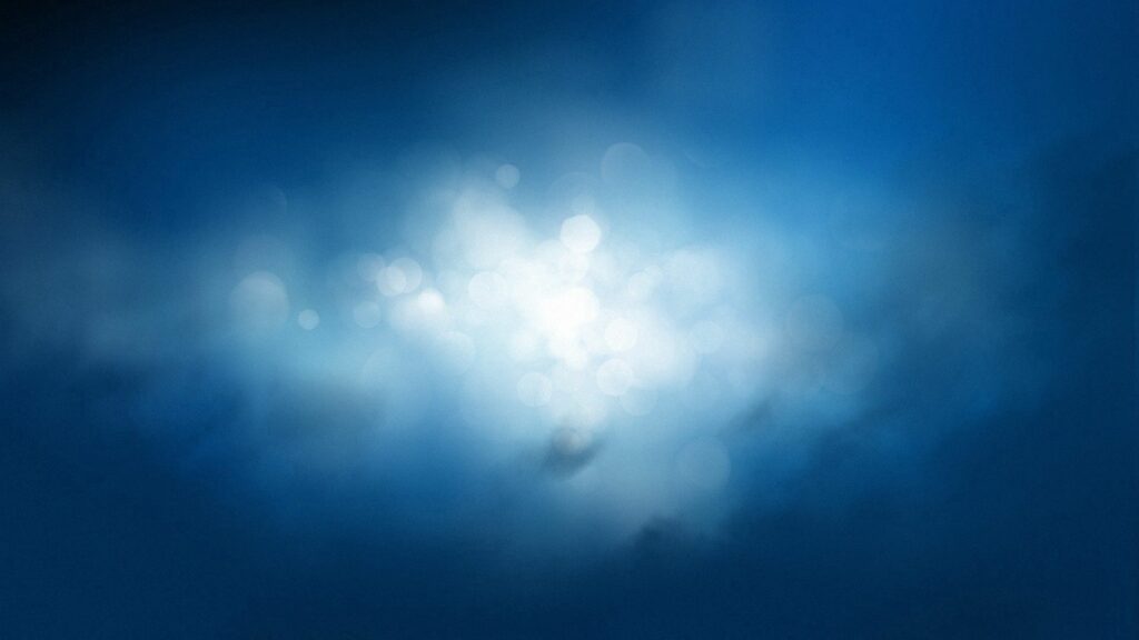 Serene Abstract Background: Soothing Bokeh Effect in Blue Gradient Wallpaper