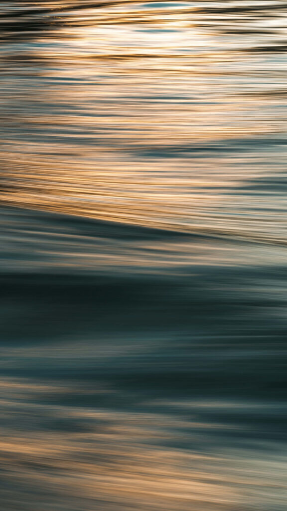 Calm Abstract Water Wallpaper with Golden Ripples and Fluid Lines