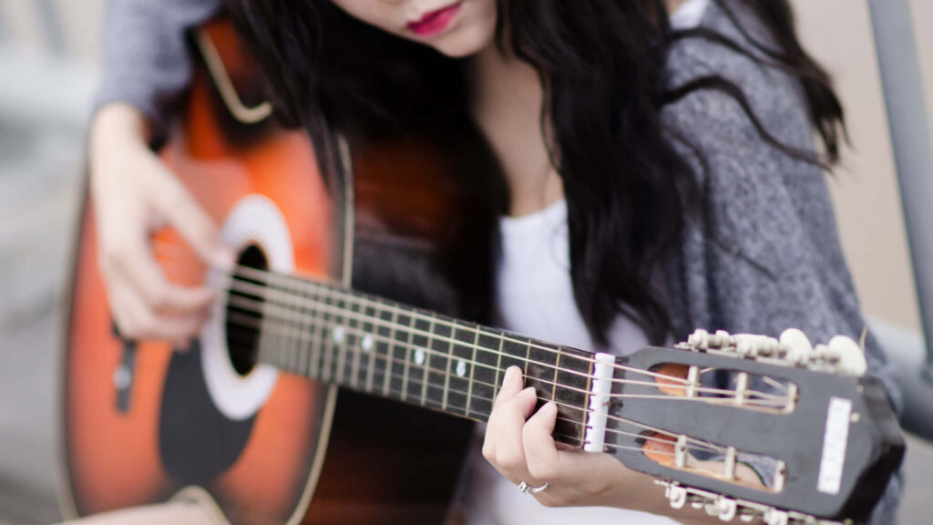 Peaceful Girl Playing Acoustic Guitar - Artistic Wallpaper Background