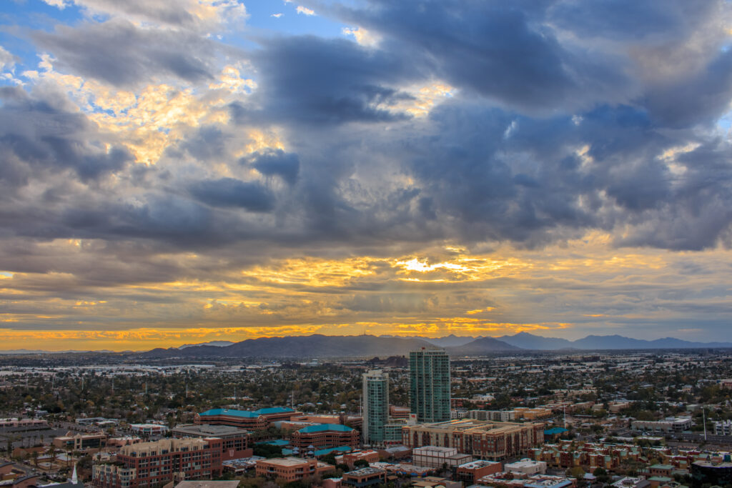 Aerial Cityscape Wallpaper: Stunning Sunset & Dramatic Clouds