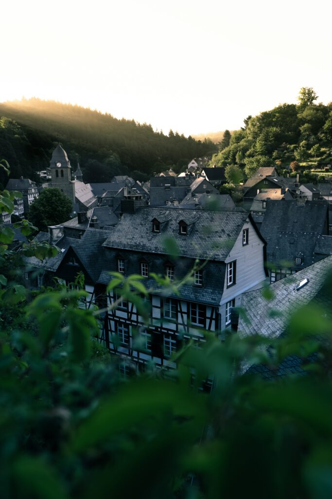 Serene Village Aerial Wallpaper: Charming Architecture & Sunset Glow