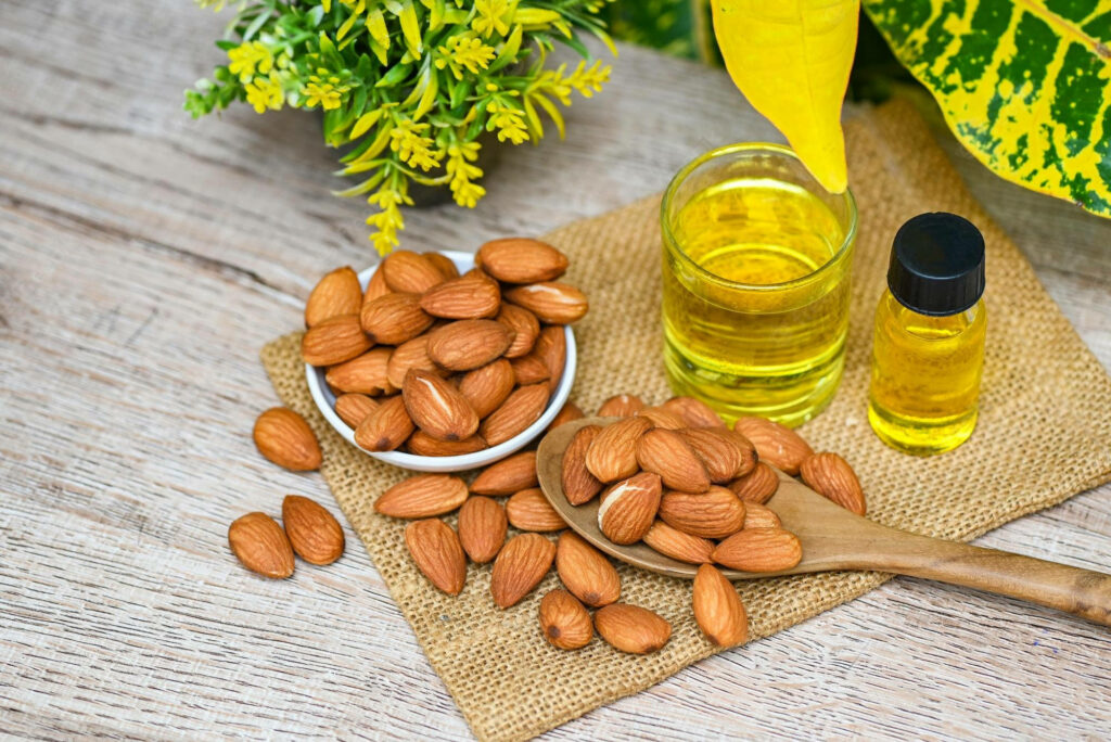 Calm Almond Essential Oil Wallpaper with Fresh Almonds & Greenery