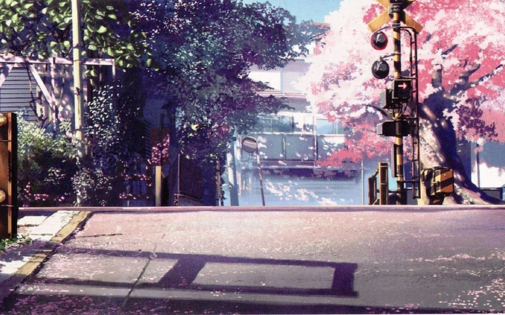 Peaceful Japanese railroad crossing with blooming cherry blossoms in warm spring sunlight wallpaper
