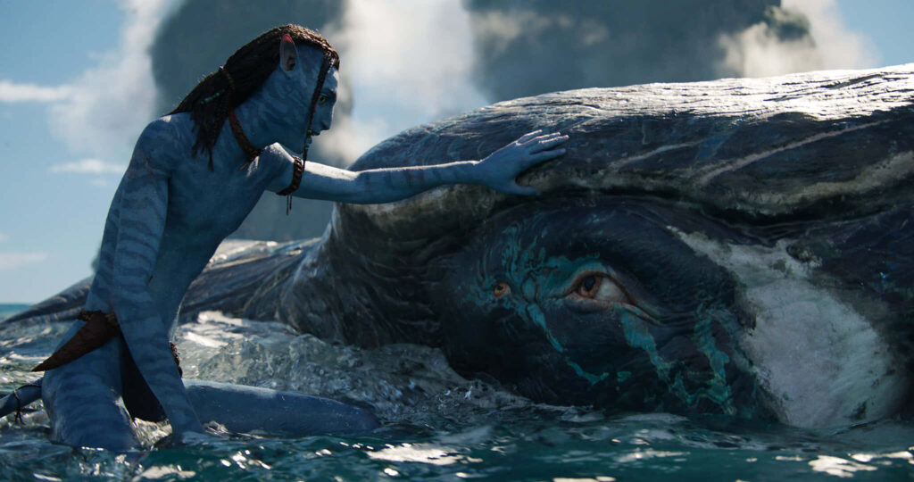 Serene *Avatar* Wallpaper: Character & Whale Bonding in Ocean