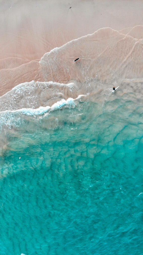 Serene Beach Aerial Wallpaper: Calming Turquoise Ocean & Sand