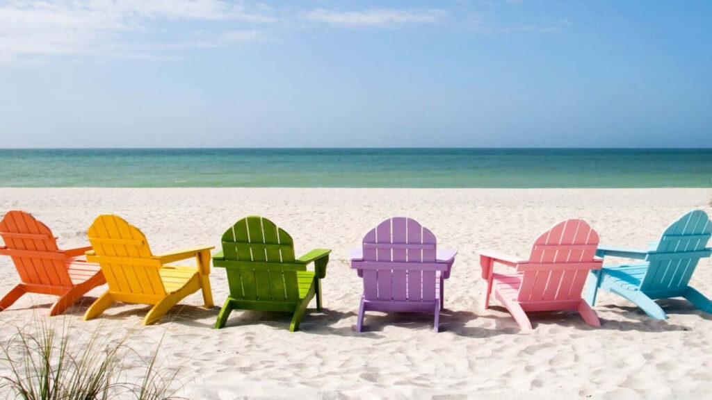 Serene Beach HD Wallpaper: Colorful Adirondack Chairs & Turquoise Ocean
