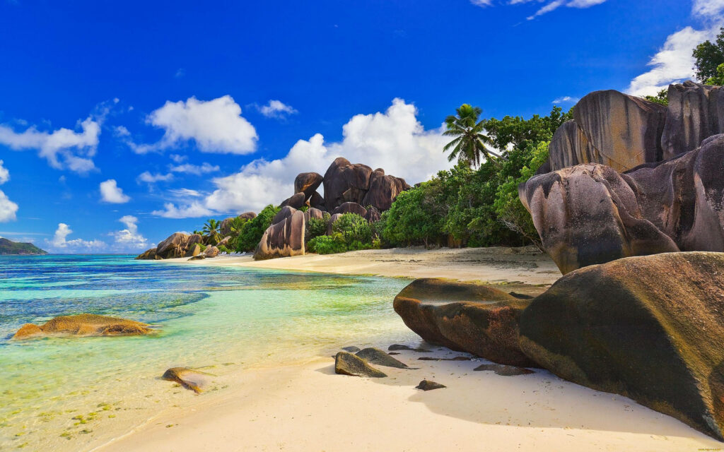Serene Beach Landscape Wallpaper: Stunning Rocks & Clear Waters