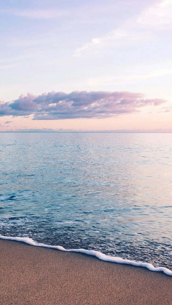 Pastel Beach Sunset Wallpaper: Tranquil Ocean Waves Background