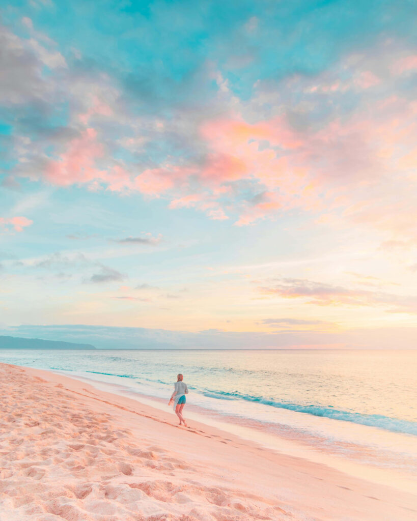 Serene Beach Sunset Wallpaper: Tranquil Pastel Hues & Solitary Stroll