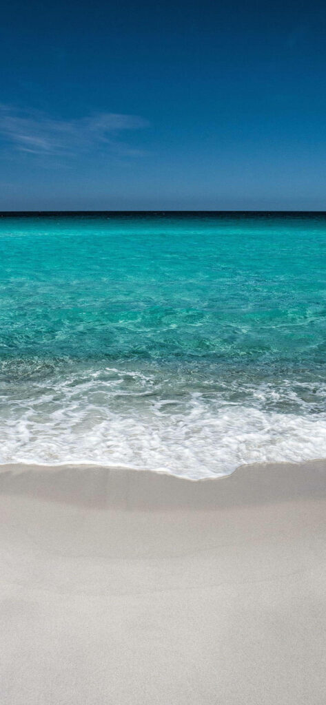Serene Beach Scene Wallpaper: Soft Sand & Turquoise Waters