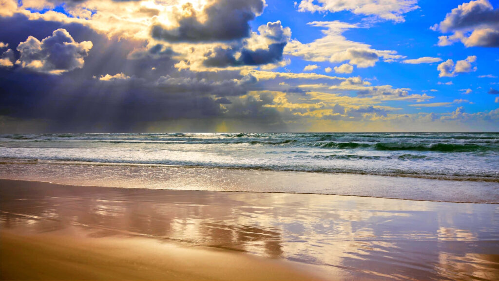 Serene Beach Wallpaper: Sunlit Waves & Clouds for a Refreshing Summer
