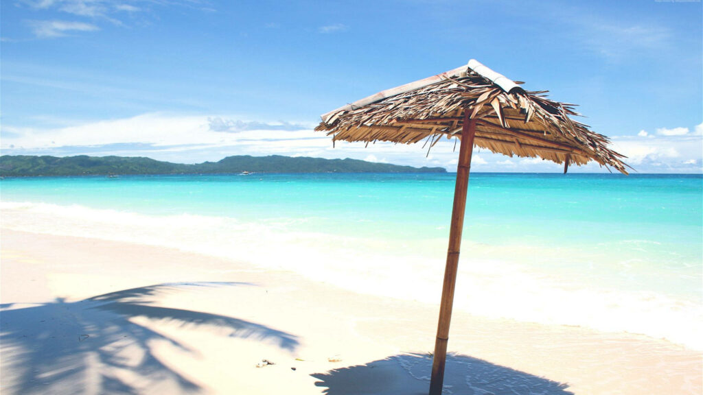 Serene Beach Wallpaper: White Sand, Turquoise Water & Parasol
