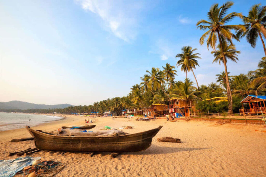 Rustic Boat on Serene Beach: Tropical Wallpaper for Relaxation
