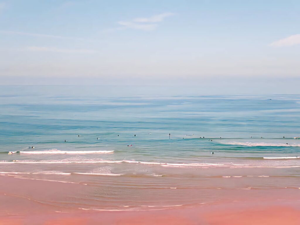 Serene Beach Wallpaper: Soft Pink Horizon for a Calming Background