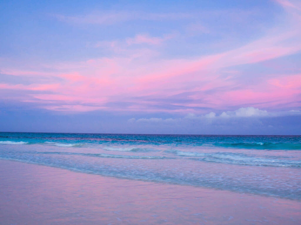 Tranquil Beachscape Wallpaper: Pastel Sunset & Gentle Waves