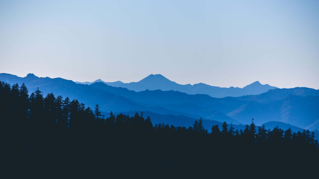 Calm Blue Mountain Ranges Wallpaper: Serene Landscape Background
