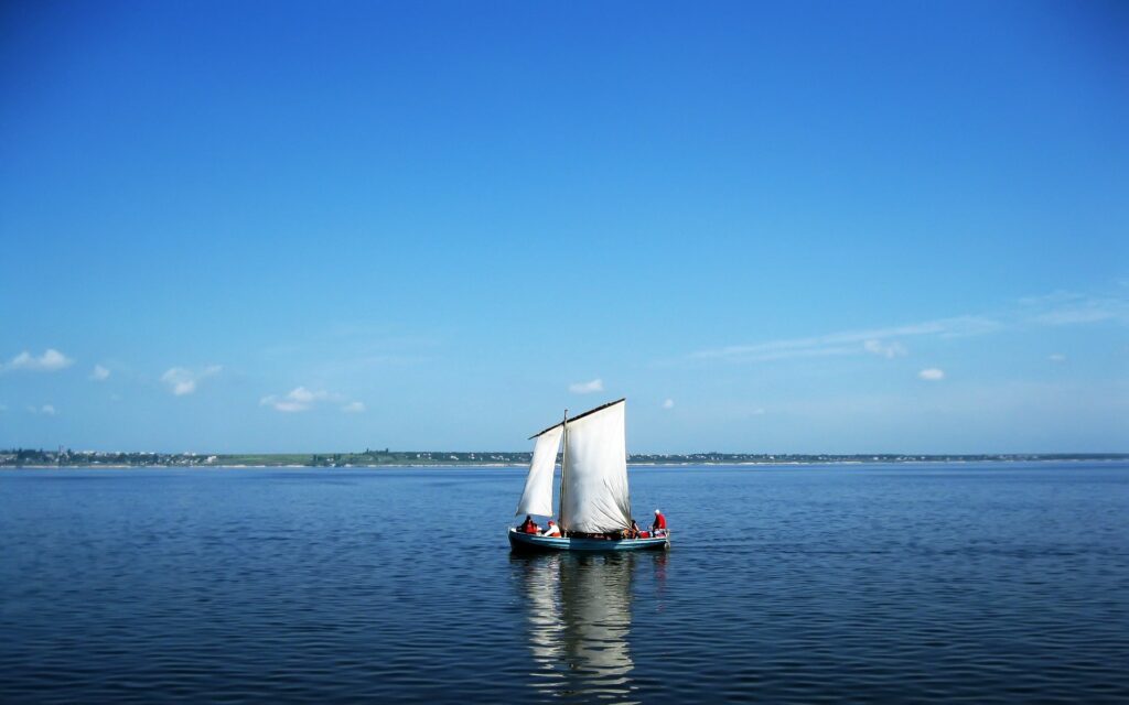 Small sailboat with scientists on calm river under clear blue sky serene wallpaper background