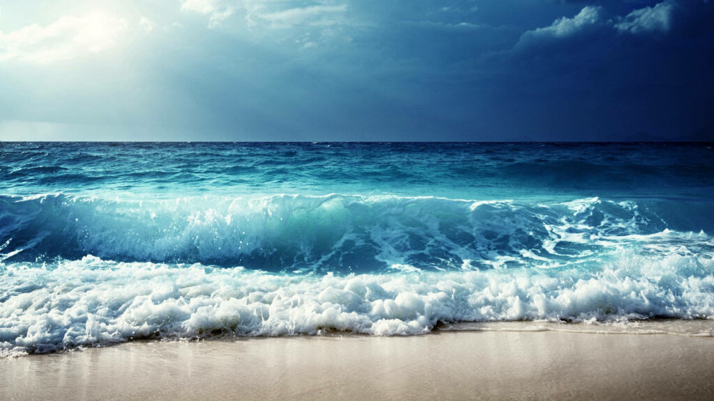 Serene Blue Sea Waves Beach Wallpaper: Peaceful Coastal Background