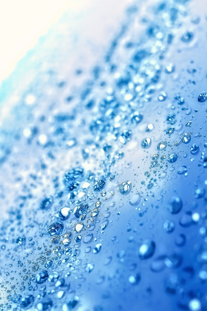 Serene Blue Water Drops Macro - Refreshing Wallpaper Background