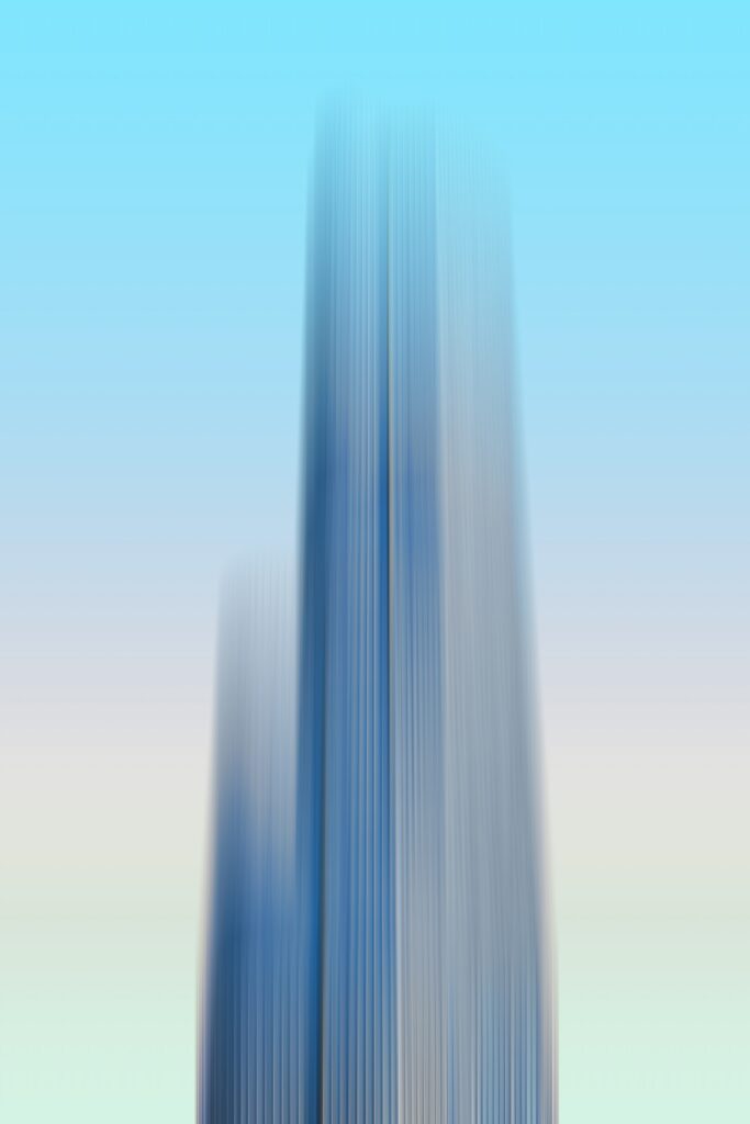 Abstract Blurred Wallpaper: Tall Building & Gradient Sky Background