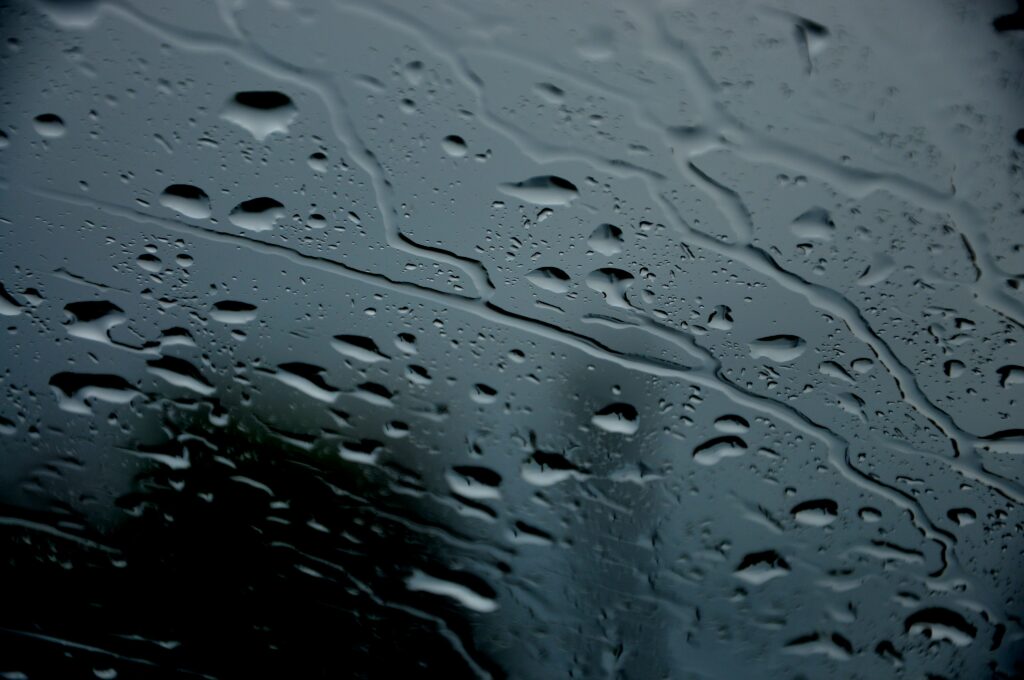 Serene Water Droplets Wallpaper: Blurred Glass Surface Background