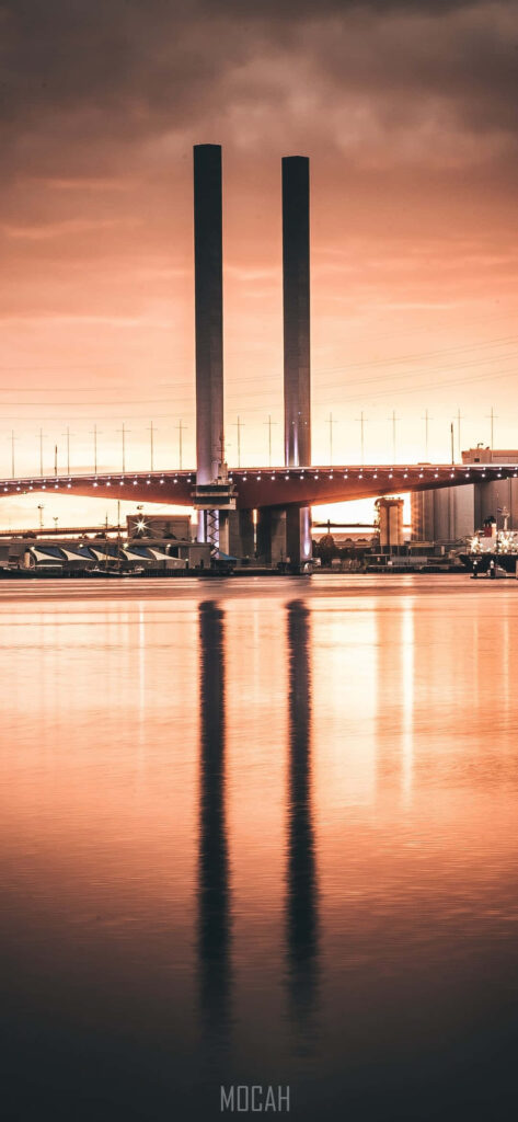 Serene Bridge Wallpaper: Stunning Reflections & Warm Sky Background
