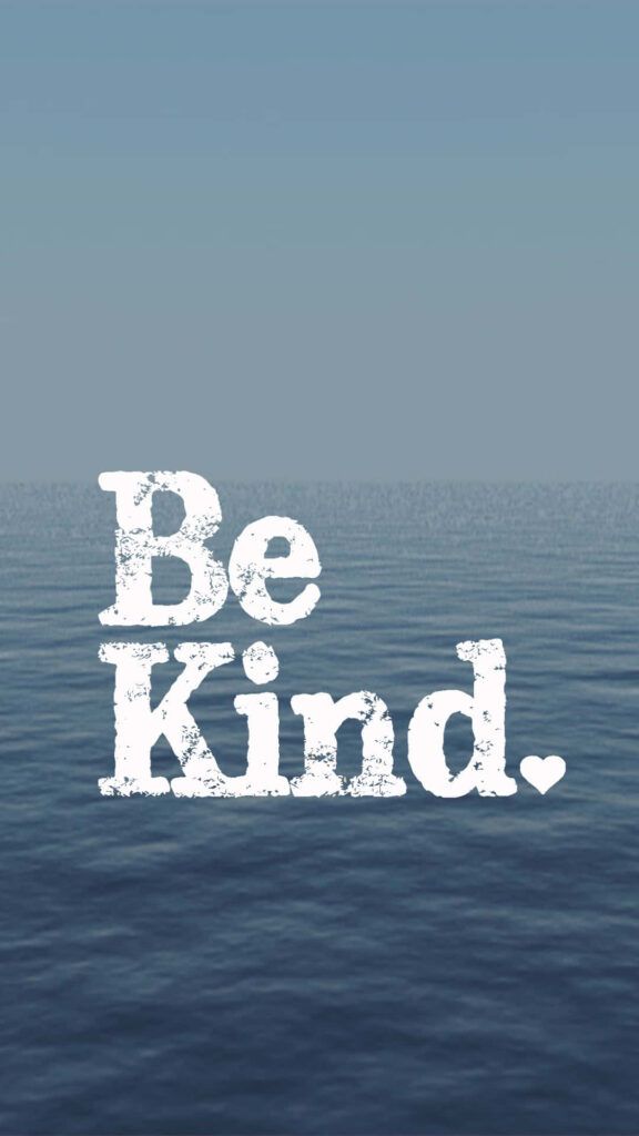 Calm ocean under clear sky with Be Kind message in white letters peaceful uplifting wallpaper