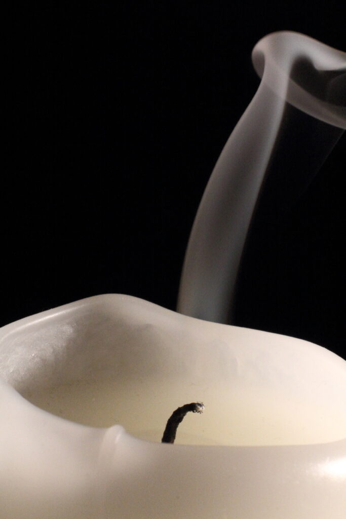 Serene Candle Wick Close-Up Wallpaper with Curling Smoke