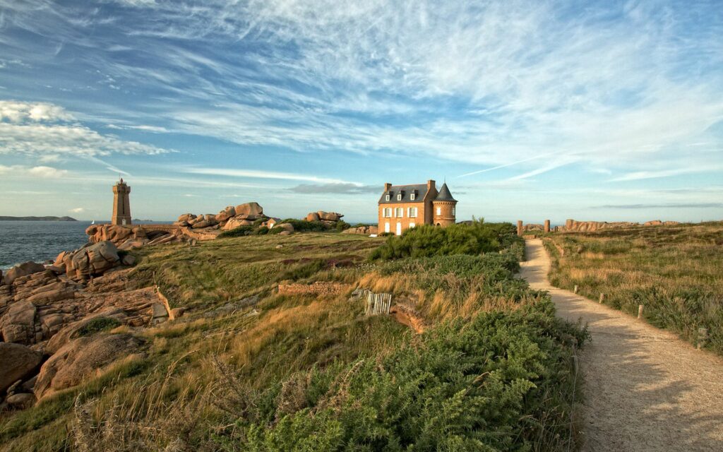Serene Castle Wallpaper: Lush Countryside & Ocean View Background