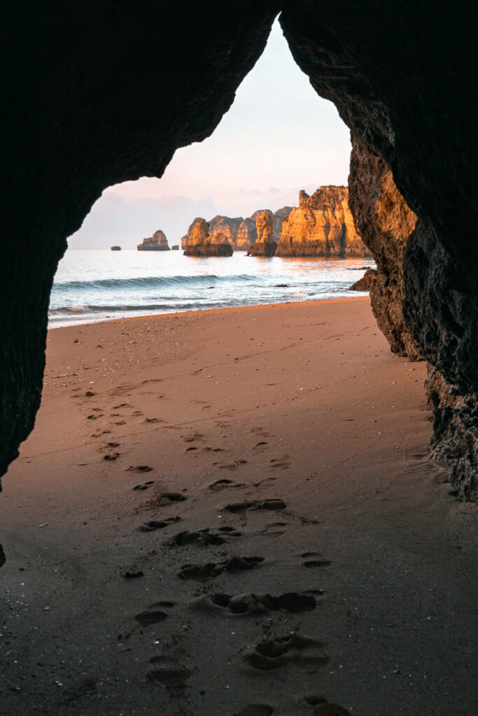Serene Cave View Wallpaper: Tranquil Beach Scene for iPhone Background