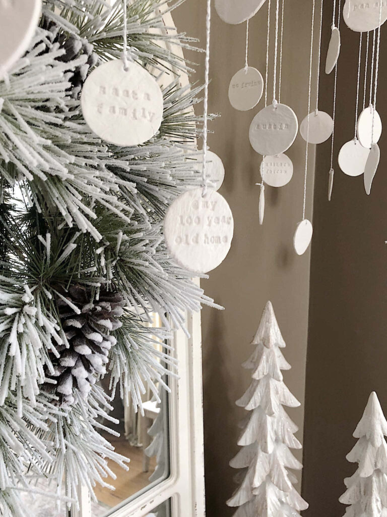 Serene Christmas Tree Wallpaper with White Ornaments & Pinecones