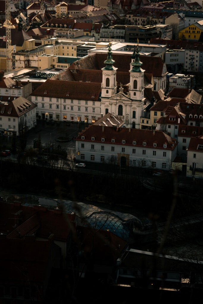 Serene Cityscape: Majestic Ancient Architecture & Modern Vibrancy Wallpaper