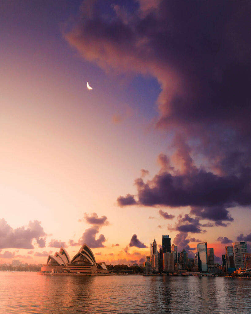 Serene Cityscape Dusk: Crescent Moon & Sunset Reflection Wallpaper