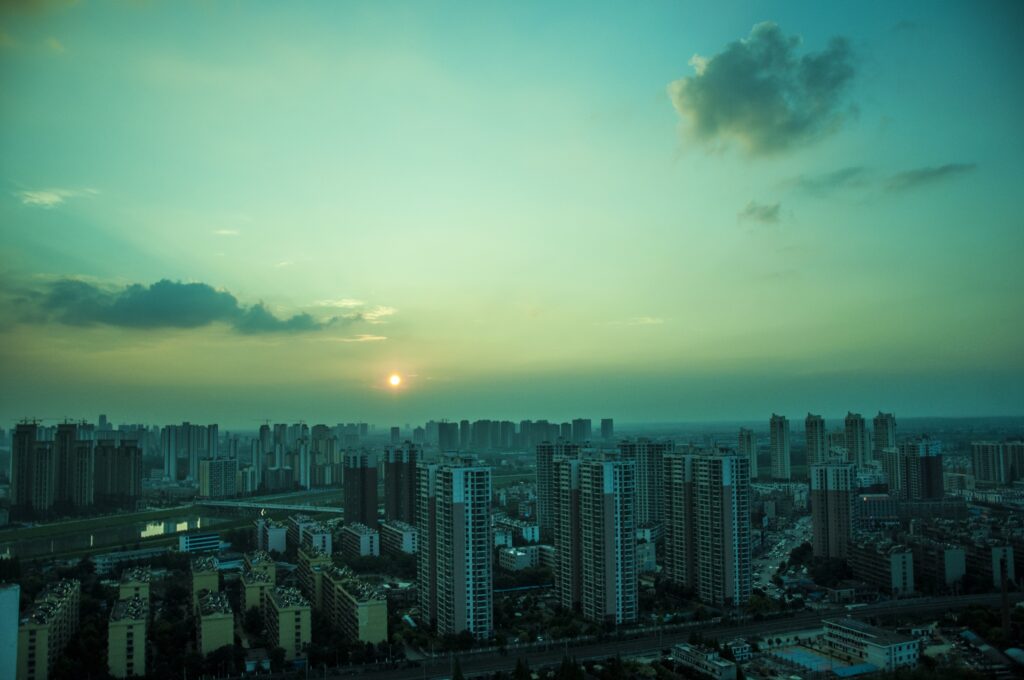 Serene Cityscape Sunset Wallpaper with Modern Urban Atmosphere