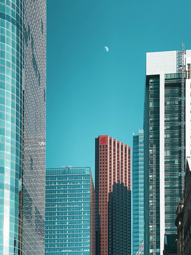 Serene Cityscape Wallpaper: Turquoise Sky & Modern Architecture
