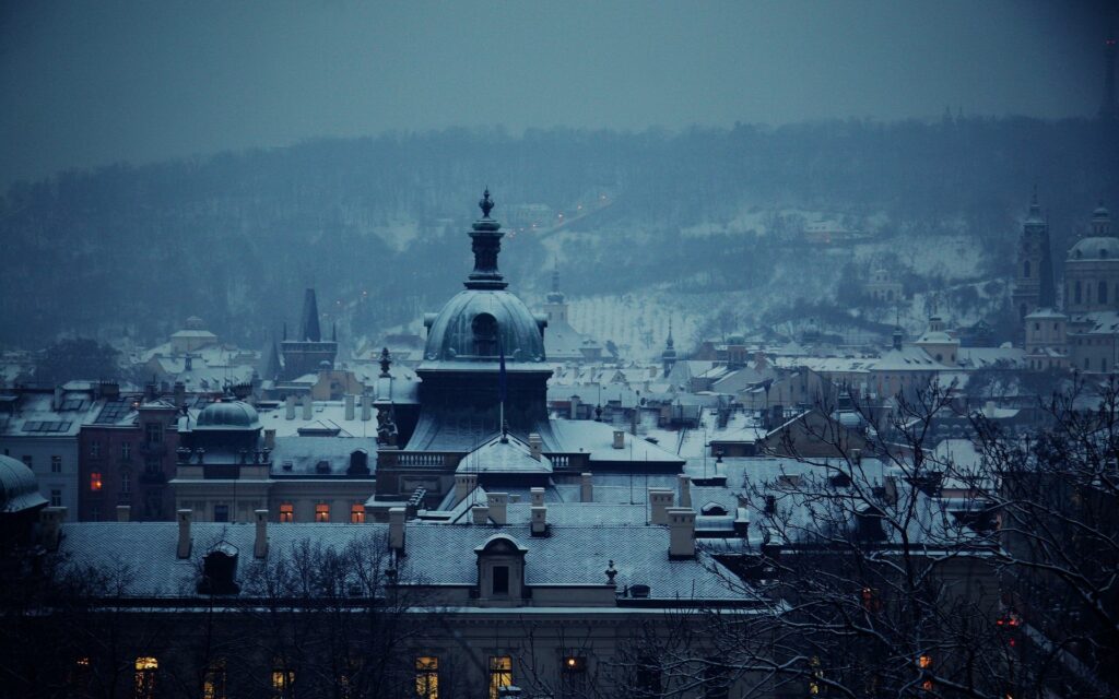 Serene Cityscape Dawn Wallpaper: Snowy Buildings & Church Dome