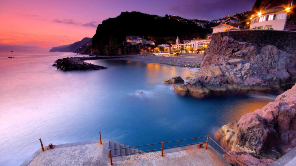 Escape to Coastal Paradise: Stunning Sunset Over Tranquil Waters Wallpaper