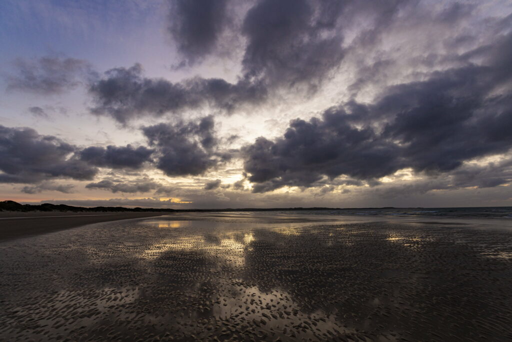 Serene Coastal HD Wallpaper with Dramatic Clouds and Reflections