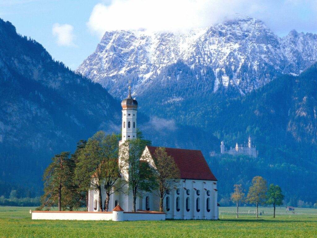 Tranquil Countryside Wallpaper: Church & Snow-Capped Mountains